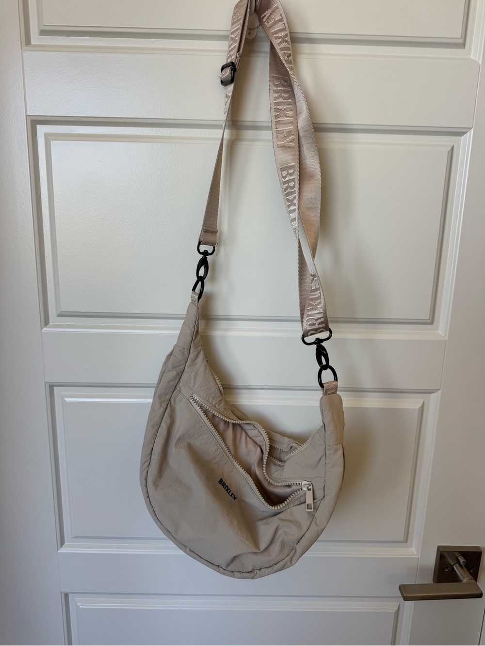 BRIELY Beige Crossbody Hobo Bag with Adjustable Logo Strap